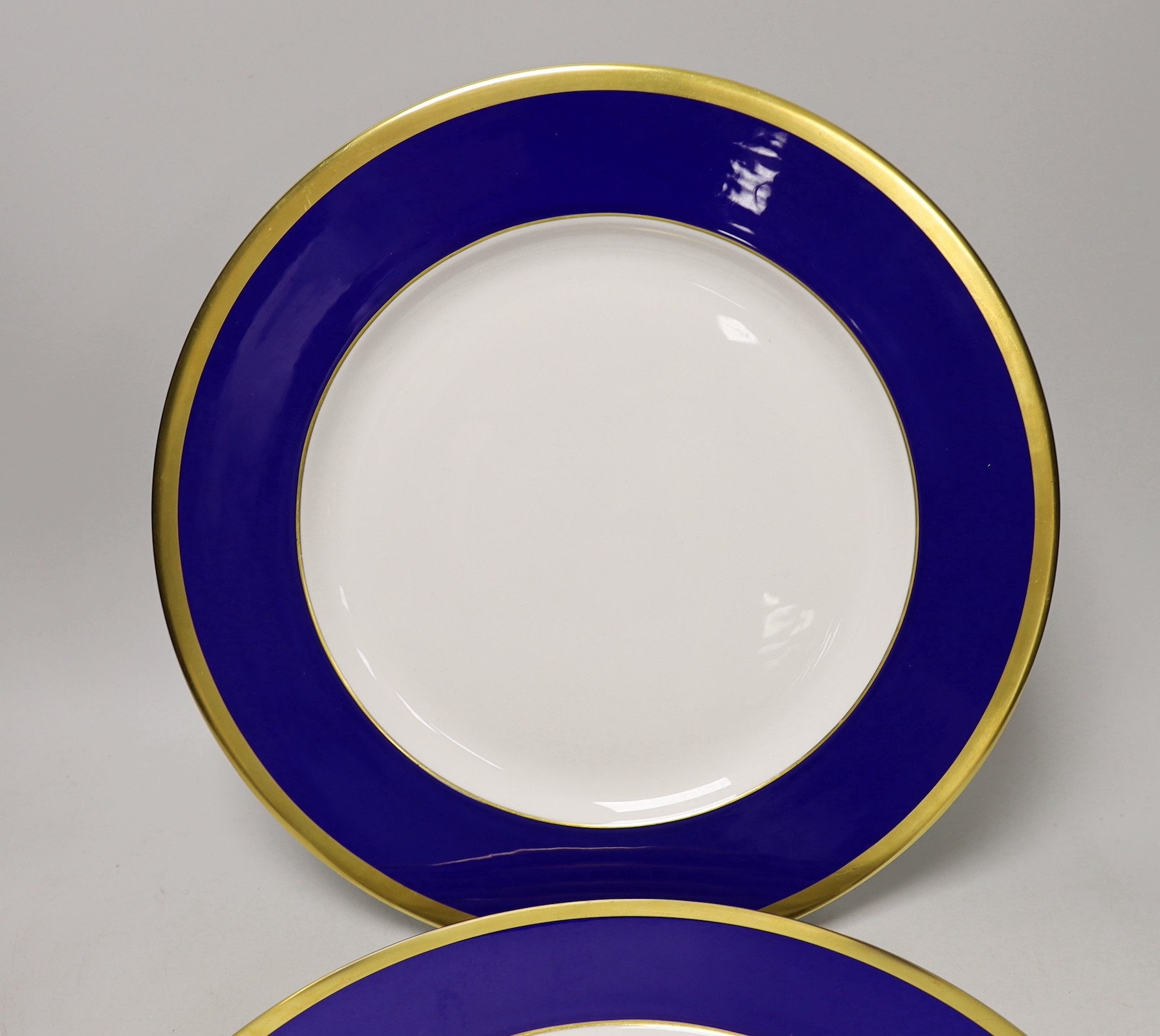Six Asprey, London, blue and gilt banded dinner plates, 34cms diameter
